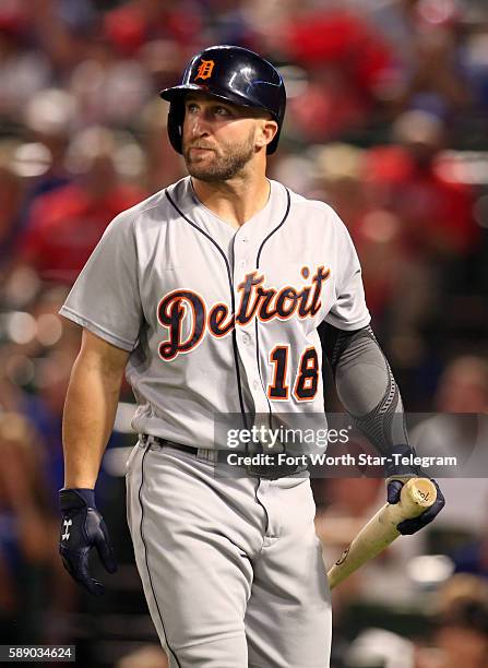 The Detroit Tigers' Tyler Collins walks back to the dugout after striking out against Texas Rangers starting pitcher Yu Darvish in the first inning...
