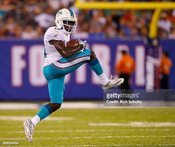 Jakeem Grant of the Miami Dolphins makes a catch for a first down during the second half against the New York Giants in an NFL preseason game at...
