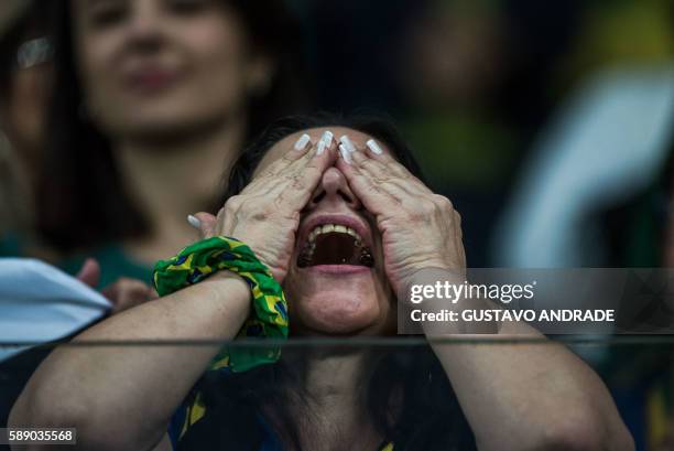 Fan of Brazil gestures during the penalty shoot-out of the Rio 2016 Olympic Games women's quarterfinal football match between Brazil and Australia at...