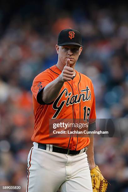 Matt Cain of the San Francisco Giants gives a thumbs up to a teammate after the top of the first inning against the Baltimore Orioles during an...