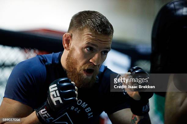 Featherweight champion Conor McGregor trains during an open workout at his gym on August 12, 2016 in Las Vegas, Nevada. McGregor is scheduled to...