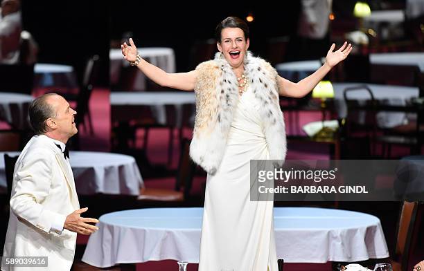 Actors Sven-Eric Bechtolf as 'Doctor' and Annett Renneberg as 'Queen of the Night' perform during the rehearsal of the play 'The Ignoramus and the...