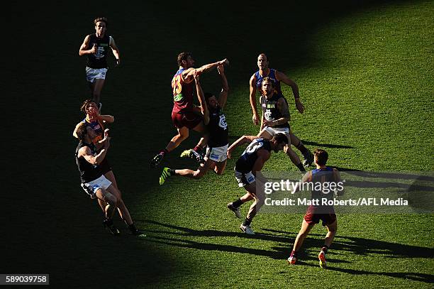 Michael Close of the Lions spoils the mark during the round 21 AFL match between the Brisbane Lions and the Carlton Blues at The Gabba on August 13,...