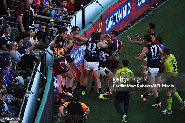 Players of the Lions and the Blues wrestle during the round 21 AFL match between the Brisbane Lions and the Carlton Blues at The Gabba on August 13,...