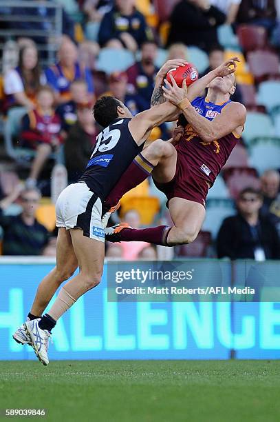 Mitch Robinson of the Lions marks under pressure during the round 21 AFL match between the Brisbane Lions and the Carlton Blues at The Gabba on...