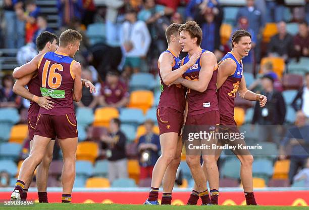 Lions players celebrate their victory after the round 21 AFL match between the Brisbane Lions and the Carlton Blues at The Gabba on August 13, 2016...