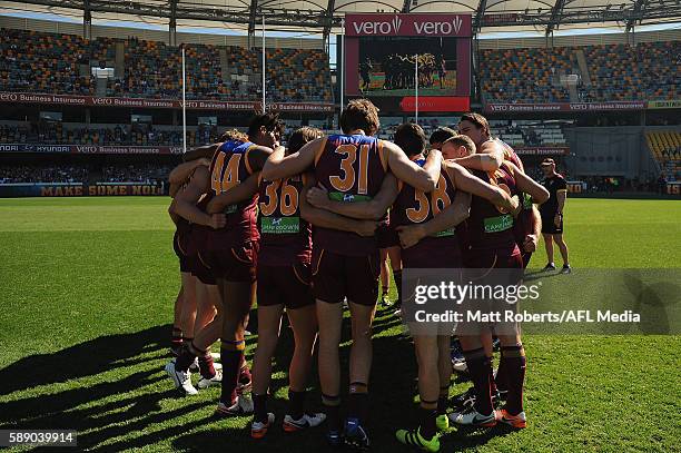 Players of the Lions huddle before the round 21 AFL match between the Brisbane Lions and the Carlton Blues at The Gabba on August 13, 2016 in...