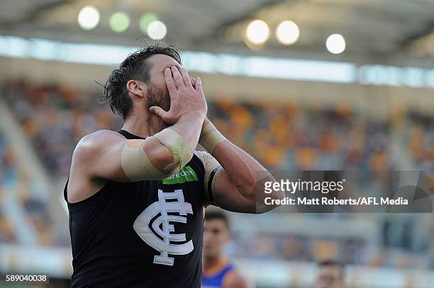 Dale Thomas of the Blues looks dejected after an attempt at goal during the round 21 AFL match between the Brisbane Lions and the Carlton Blues at...