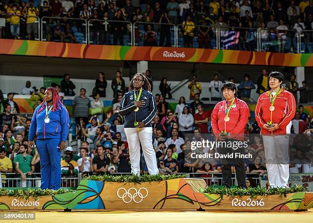 Over 78kg medallists L-R: Silver; Idalys Ortiz of Cuba, Gold; Emilie Andeol of France, Bronzes; Kanae Yamabe of Japan and Song Yu of China during the...