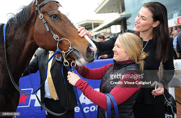 Jordan Chalmers and Nina O'Brien with Miss Rose de Lago after winning Race 7, P.B Lawrence Stakes during Melbourne Racing at Caulfield Racecourse on...