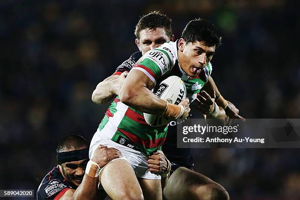 Kyle Turner of the Rabbitohs on the charge against Ryan Hoffman of the Warriors during the round 23 NRL match between the New Zealand Warriors and...