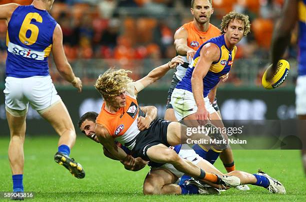 Adam Kennedy of the Giants is injured in this tackle during the round 21 AFL match between the Greater Western Sydney Giants and the West Coast...