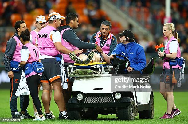 Adam Kennedy of the Giants receives medical attention after a tackle tackle during the round 21 AFL match between the Greater Western Sydney Giants...