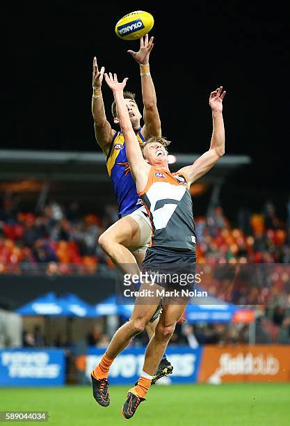 Elliot Yeo of the Eagles and Lachie Whitfield of the Giants contest a mark during the round 21 AFL match between the Greater Western Sydney Giants...