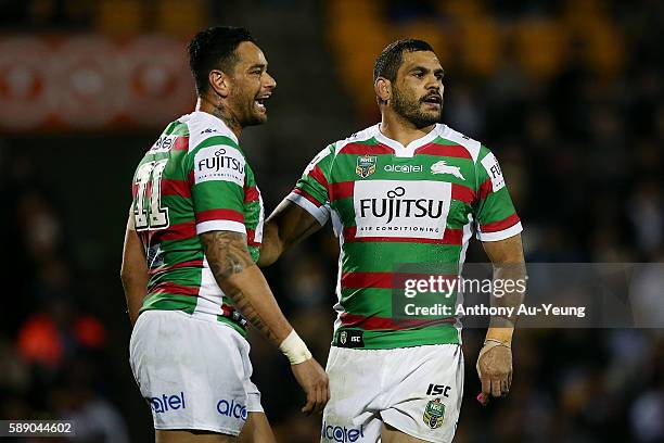 Greg Inglis and John Sutton of the Rabbitohs look on during the round 23 NRL match between the New Zealand Warriors and the South Sydney Rabbitohs at...