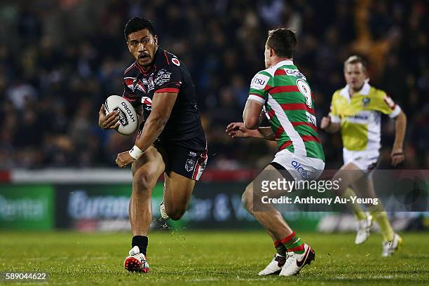 Albert Vete of the Warriors charges into Damien Cook of the Rabbitohs during the round 23 NRL match between the New Zealand Warriors and the South...