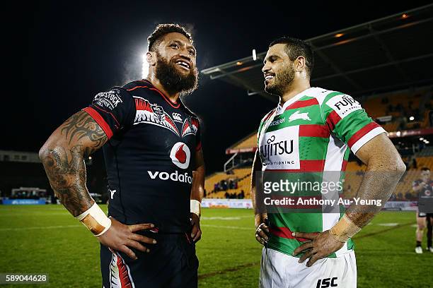 Manu Vatuvei of the Warriors chats with Greg Inglis of the Rabbitohs after the round 23 NRL match between the New Zealand Warriors and the South...