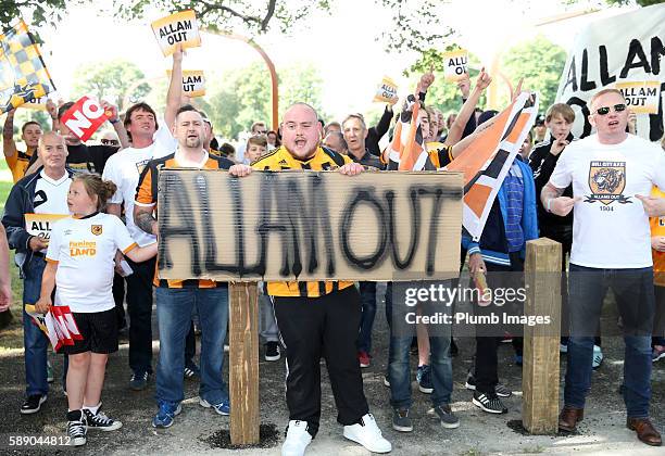 Hull City fans stage a protest against club owner and chairman Assem Allam outside KC Stadium ahead of the Premier League match between Leicester...