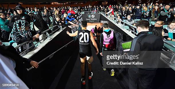 Chad Wingard of the Power walks from the ground at half time after injuring his hamstring during the round 21 AFL match between the Port Adelaide...