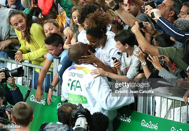 Teddy Riner of France celebrates with Luthna Plocus and their son Eden Riner winning the gold medal in the Men +100kg Final on day 7 of the 2016 Rio...
