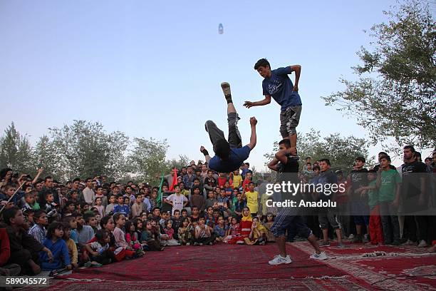 Internally displaced Afghan children perform during the 11th Afghanistan National Juggling Championship organized by the Mobile Mini Circus for...