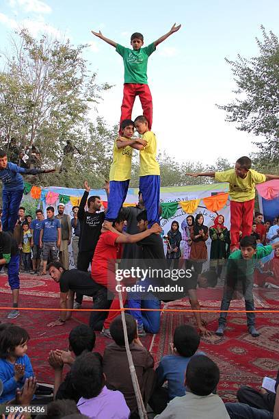 Internally displaced Afghan children perform during the 11th Afghanistan National Juggling Championship organized by the Mobile Mini Circus for...