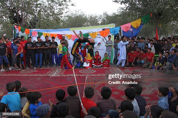 Internally displaced Afghan children perform during the 11th Afghanistan National Juggling Championship organized by the Mobile Mini Circus for...