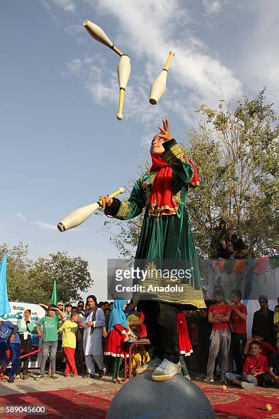 Internally displaced Afghan children perform during the 11th Afghanistan National Juggling Championship organized by the Mobile Mini Circus for...