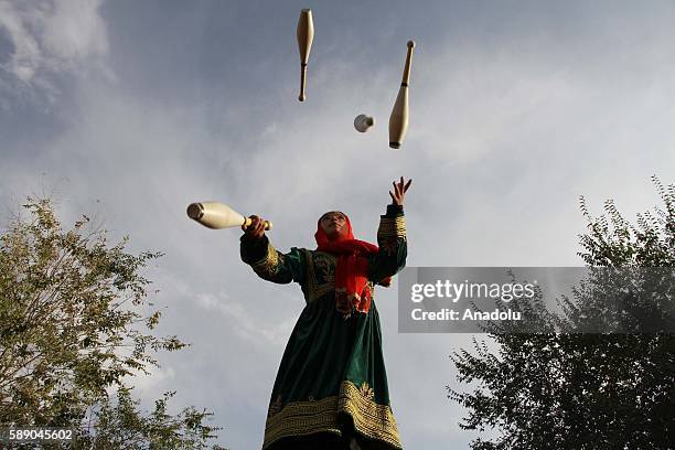 Internally displaced Afghan children perform during the 11th Afghanistan National Juggling Championship organized by the Mobile Mini Circus for...