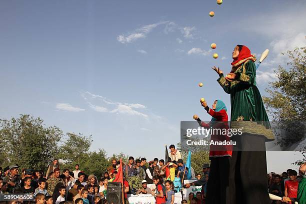 Internally displaced Afghan children perform during the 11th Afghanistan National Juggling Championship organized by the Mobile Mini Circus for...