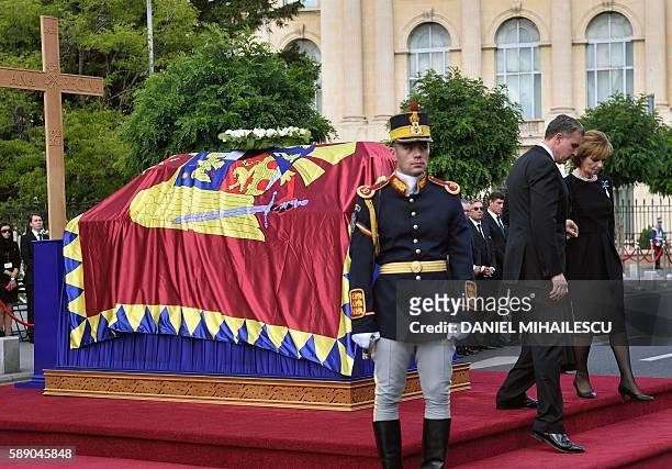 Crown Princess Margaret of Romania , one of the daughters of Quenn Anne of Romania and her husband consort Prince Duda leave the coffin of the late...