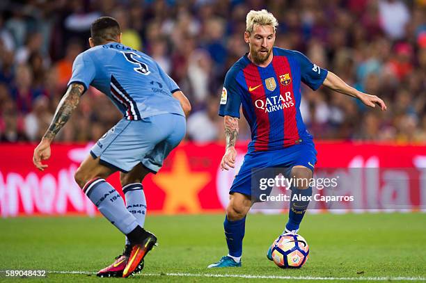 Lionel Messi of FC Barcelona dribbles Leandro Castan of UC Sampdoria during the Joan Gamper trophy match between FC Barcelona and UC Sampdoria at...