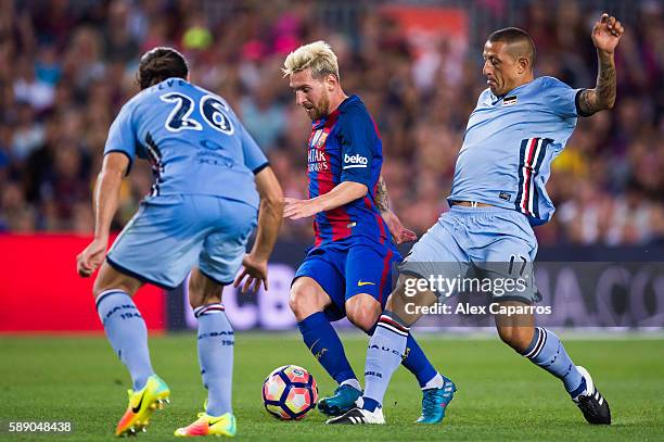 Lionel Messi of FC Barcelona conducts the ball between Matias Agustin Silvestre and Angelo Palombo of UC Sampdoria during the Joan Gamper trophy...