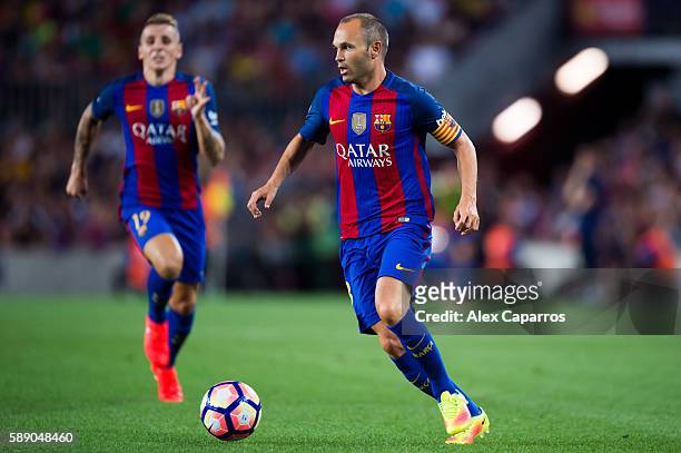 Andres Iniesta of FC Barcelona runs with the ball during the Joan Gamper trophy match between FC Barcelona and UC Sampdoria at Camp Nou on August 10,...
