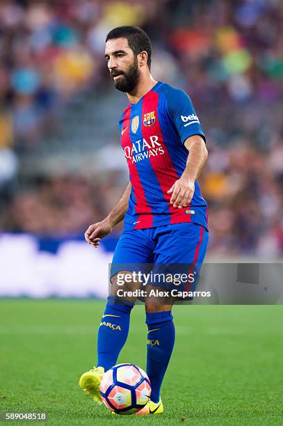 Arda Turan of FC Barcelona passes the ball during the Joan Gamper trophy match between FC Barcelona and UC Sampdoria at Camp Nou on August 10, 2016...