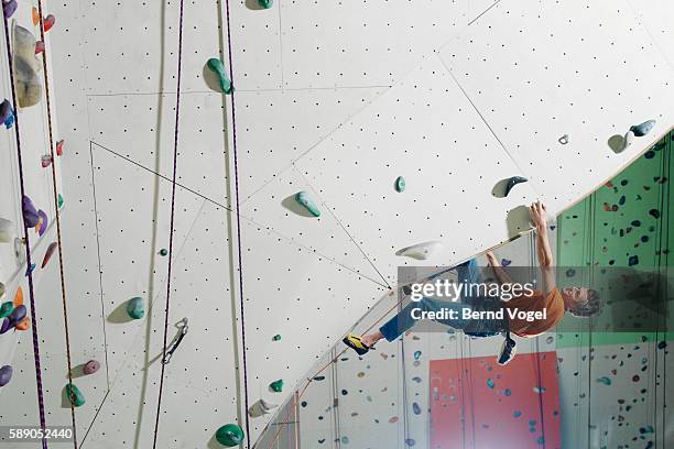 rock climber - climbing wall stock pictures, royalty-free photos & images