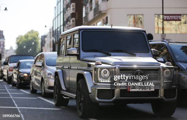 Mercedes-Benz G-Class SUV luxury car registered in Qatar drives through Knightsbridge in London on August 12, 2016.