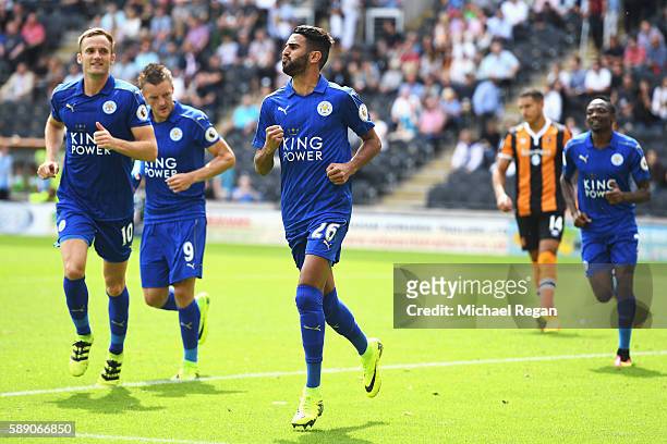 Riyad Mahrez of Leicester City celebrates scoring his sides first goal with his team mates during the Premier League match between Hull City and...