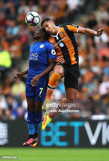 Ahmed Musa of Leicester City annd Jake Livermore of Hull City for possession in the air during the Premier League match between Hull City and...