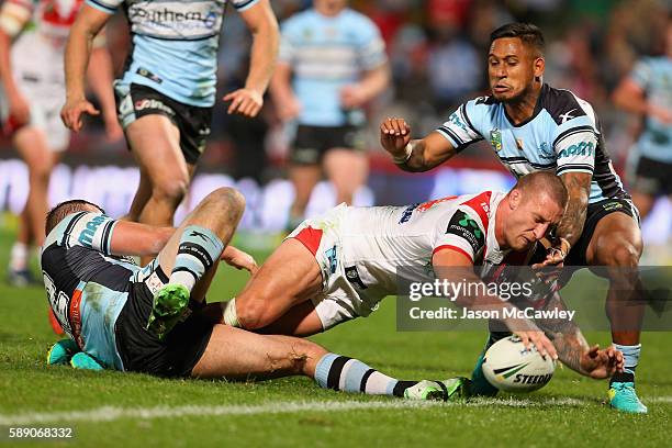 Tariq Sims of the Dragons scores a try during the round 23 NRL match between the St George Illawarra Dragons and the Cronulla Sharks at WIN Jubilee...