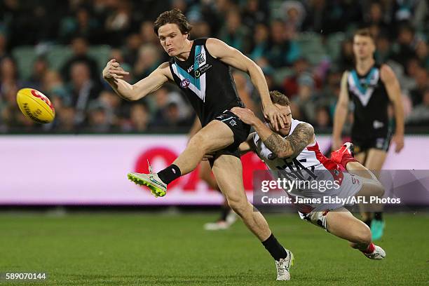 Jared Polec of the Power is tackled by Dean Kent of the Demons during the 2016 AFL Round 21 match between Port Adelaide Power and the Melbourne...