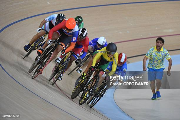 Lithuania's Simona Krupeckaite races during the women's Keirin first round track cycling event at the Velodrome during the Rio 2016 Olympic Games in...