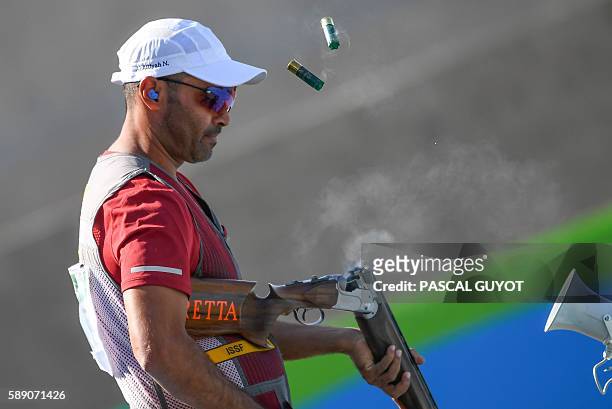 Qatar's Nasser Al Attiya competes during the Skeet men's qualifications at the Olympic Shooting Centre in Rio de Janeiro on August 13 during the Rio...