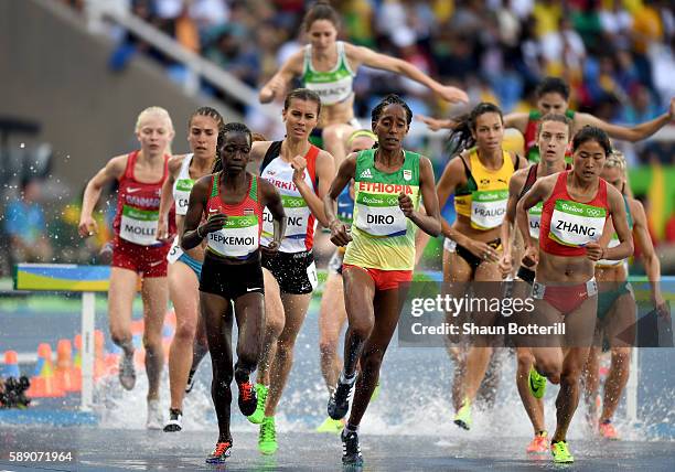 Hyvin Kiyeng Jepkemoi of Kenya, Etenesh Diro of Ethiopia and Xinyan Zhang of China compete in round one of the Women's 3000m Steeplechase on Day 8 of...