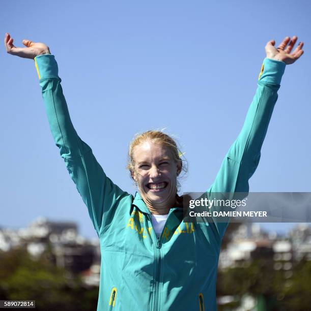 Gold medallist Australia's Kimberley Brennan celebrates on the podium of the Women's Single Sculls final rowing competition at the Lagoa stadium...
