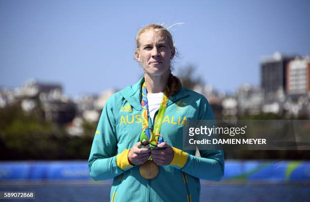 Gold medallist Australia's Kimberley Brennan celebrates on the podium of the Women's Single Sculls final rowing competition at the Lagoa stadium...