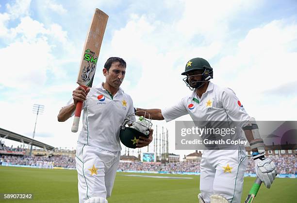 Younis Khan of Pakistan is congratuted by Sohail Khan as he leaves the field after making 218 during day three of the 4th Investec Test between...