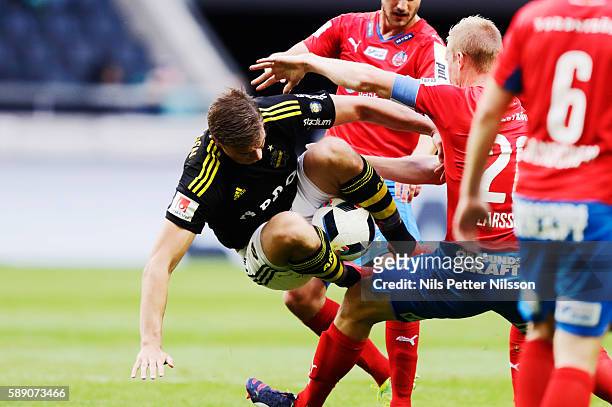 Eero Markkanen of AIK and Peter Larsson of Helsingborgs IF during the allsvenskan match between AIK and Helsingborgs FF at Friends arena on August...