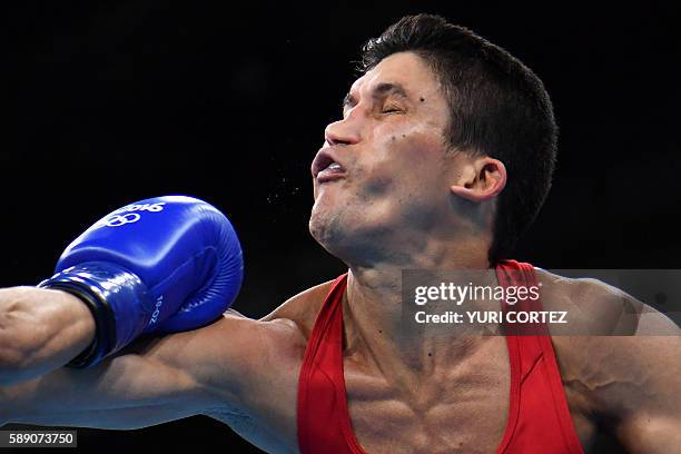 Brazil's Juliao Neto is punched by USA's Antonio Vargas during the Men's Fly at the Rio 2016 Olympic Games at the Riocentro - Pavilion 6 in Rio de...