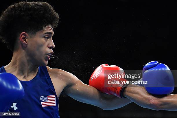 S Antonio Vargas blocks a punch from Brazil's Juliao Neto during the Men's Fly at the Rio 2016 Olympic Games at the Riocentro - Pavilion 6 in Rio de...